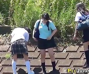 Asian teenagers outdoors..